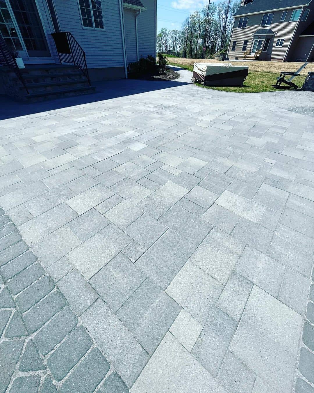gray backyard patio pavers cleaned by royal exterior cleaning llc in Bergen County