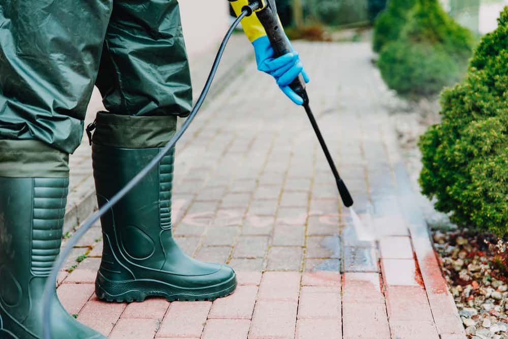 pressure washer cleaning pavers.